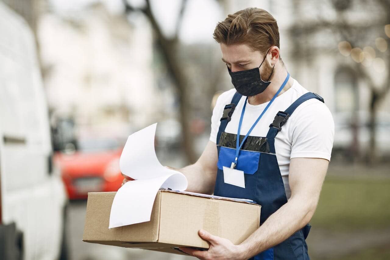 Delivery driver holding a parcel